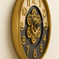Decorative wall clock with gold gears on a beige background